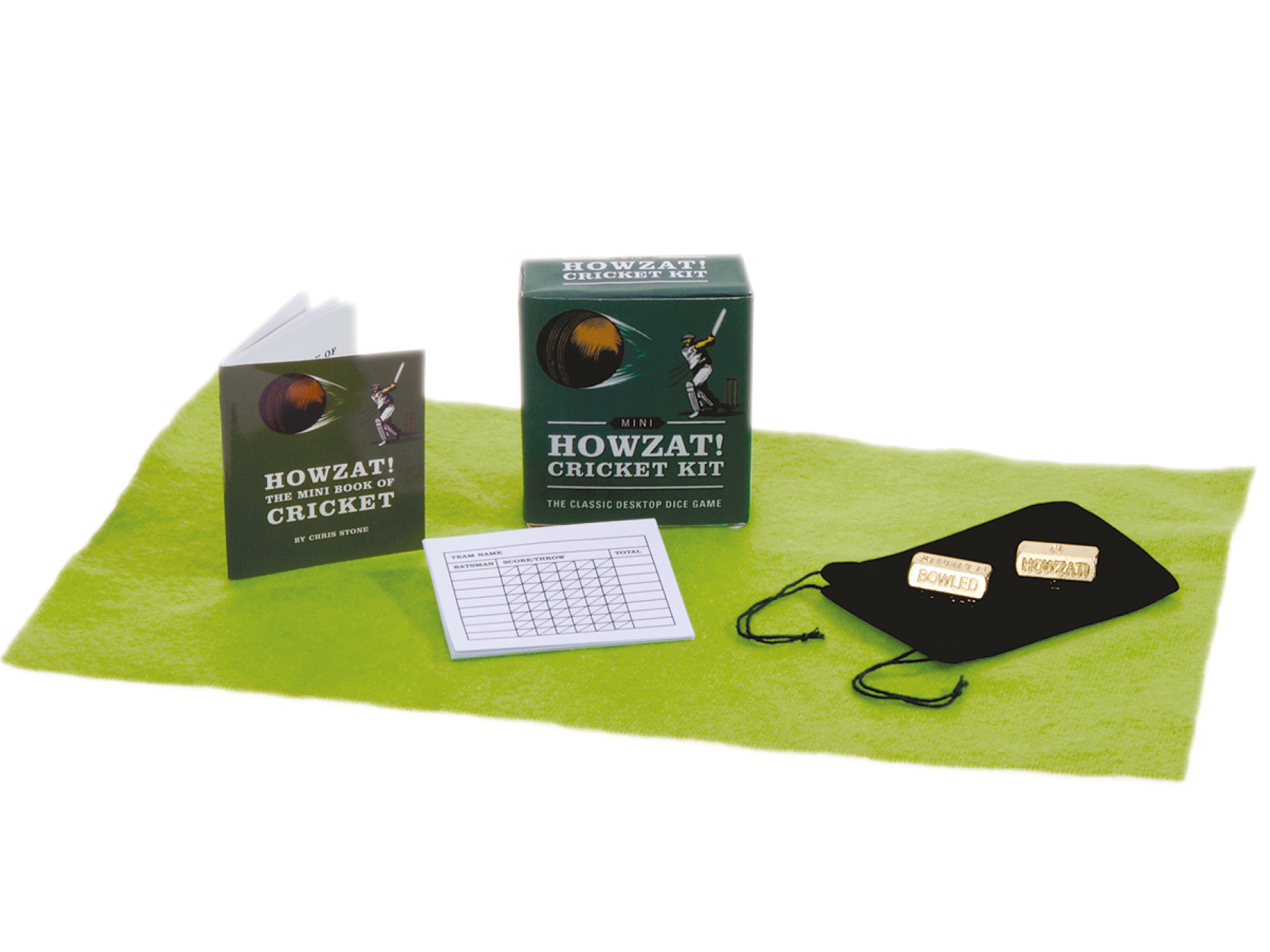 Contents of the Howzat Cricket Mini Kit showing dice, instruction book and score pad